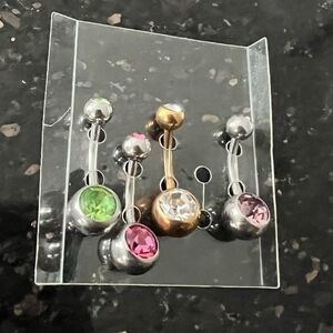🍭4/$20 Set of four jewel studded silver and gold tone belly button rings